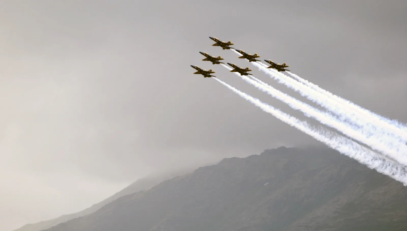 The U.S. Navy Blue Angels fly in delta formation at an air show in Alaska. The picture does not show the Peachtree City show.