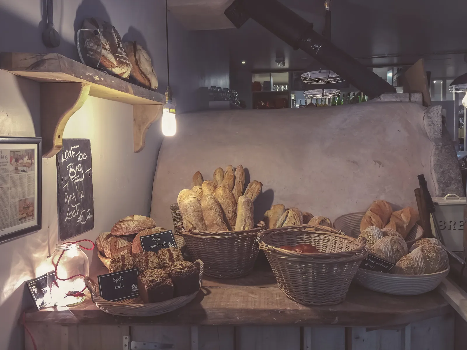 Loaves of crusty artisan bread on a wooden surface. The photo was not taken in Peachtree City.