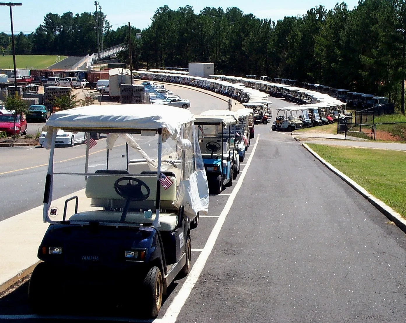 Golf carts lined up in the student parking area at McIntosh High School, Peachtree City.