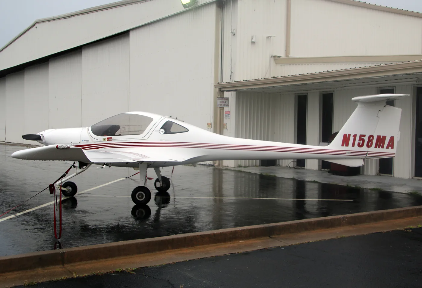 A light aircraft outside a hangar at Atlanta Regional Airport, Falcon Field, in Peachtree City