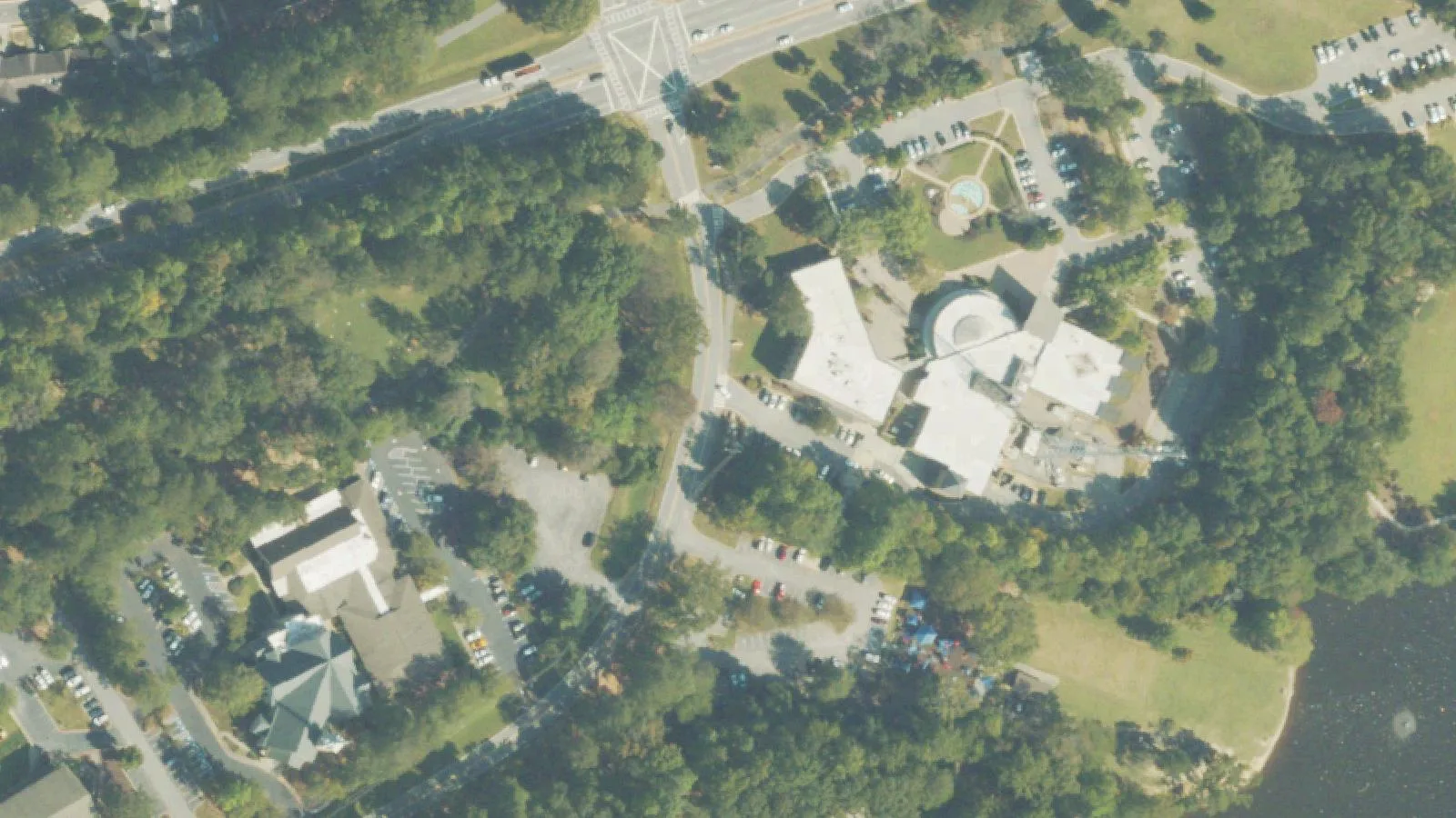 Peachtree City's City Hall and library campus on Willowbend Road, beside Lake Peachtree, seen from above.