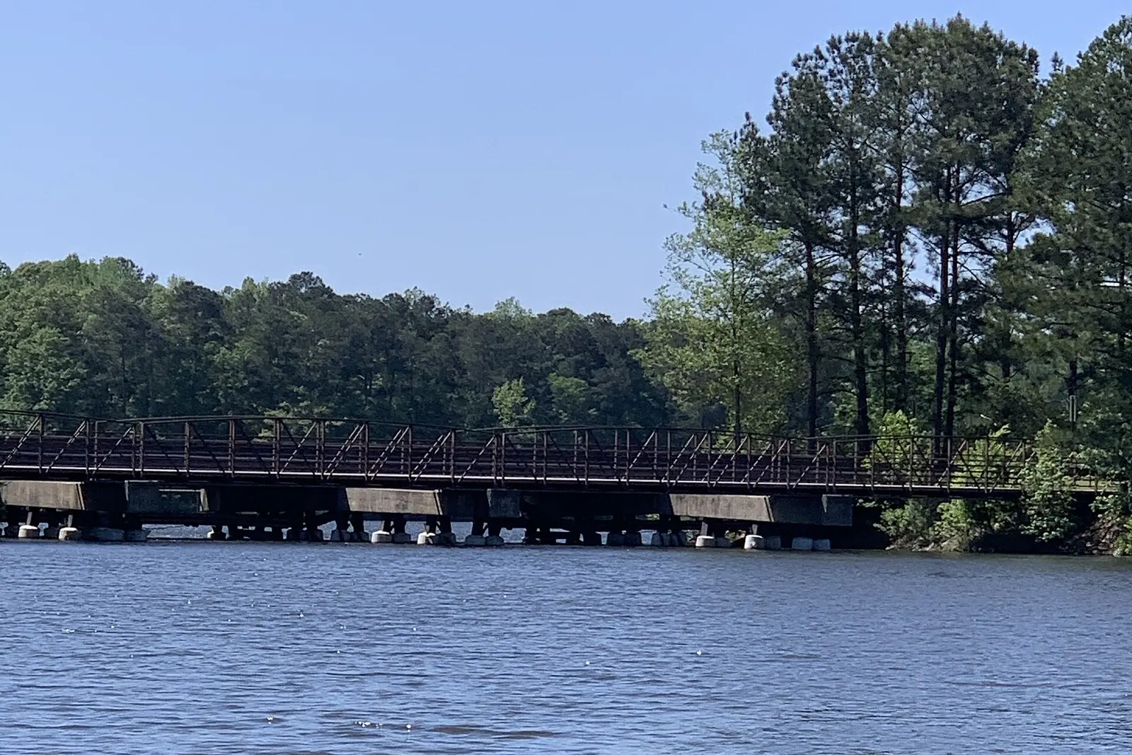 Peachtree Parkway and a golf cart path bridge crossing Lake Kedron in Peachtree City.
