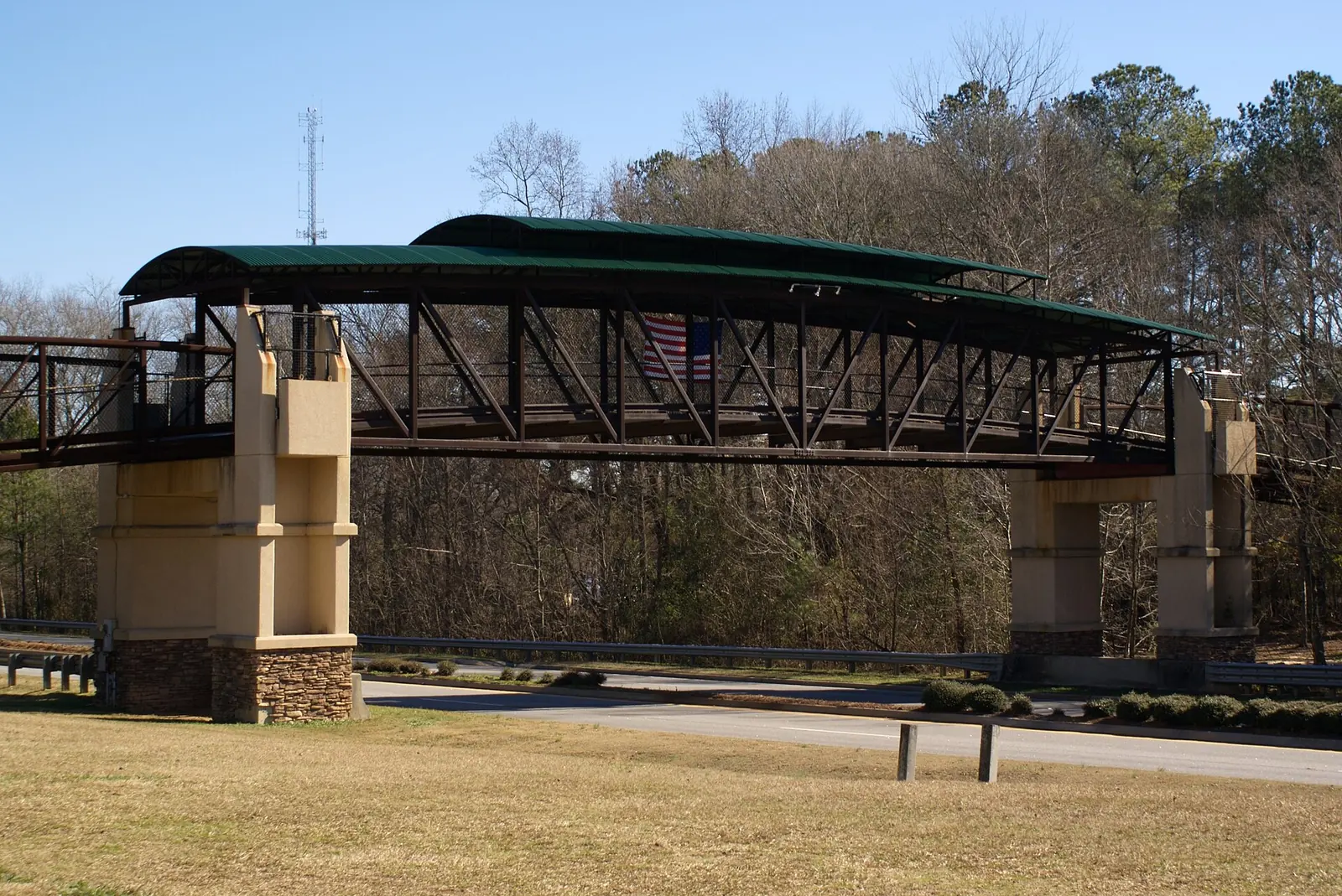 A golf cart and pedestrian bridge carrying Peachtree City's path system over Highway 54