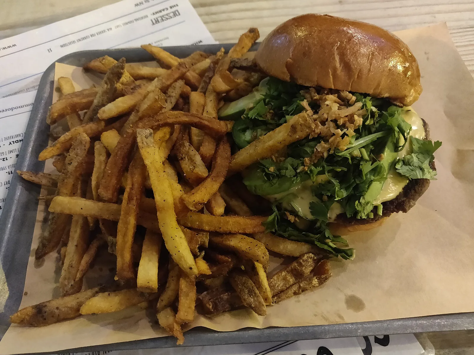A cheeseburger and fries. The photo was not taken at a Peachtree City restaurant.